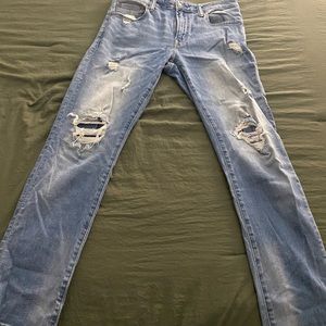 Mens blue jeans with rips